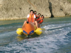 Tourist on a banana boat at Boracay beach